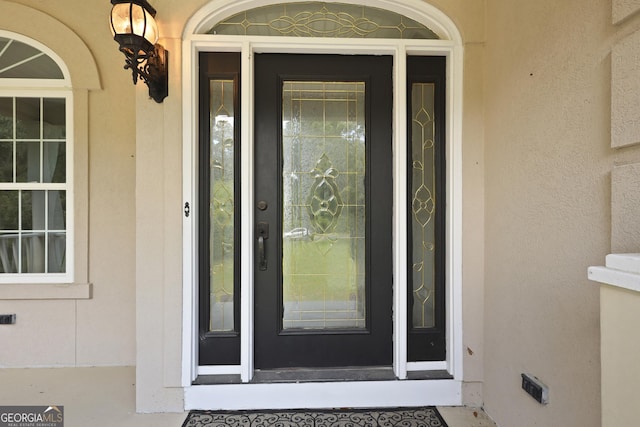 515 Youmans Rd, Midway, GA 31320 - view of exterior entry featuring stucco siding