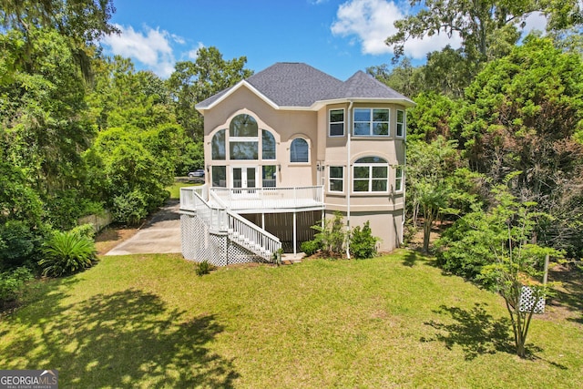 515 Youmans Rd, Midway, GA 31320 - back of house with stairway, stucco siding, a lawn, a deck, and a shingled roof