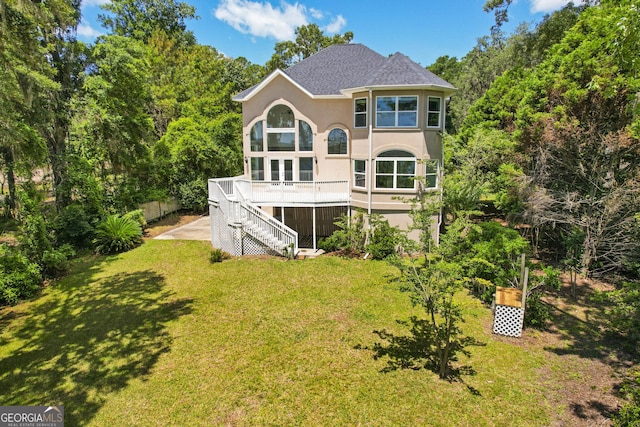 515 Youmans Rd, Midway, GA 31320 - back of house with stairway, stucco siding, a yard, and a shingled roof