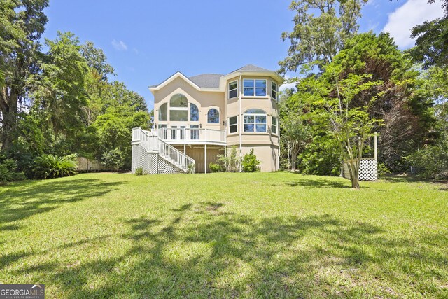 515 Youmans Rd, Midway, GA 31320 - back of house with stairway, a yard, stucco siding, and a deck