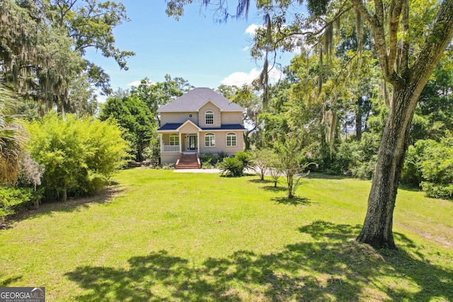 515 Youmans Rd, Midway, GA 31320 - view of front of property featuring a front lawn and a porch