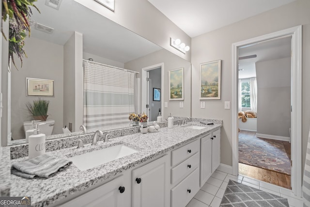 1280 Trinity Church Rd, Canton, GA 30115 - full bathroom featuring toilet, double vanity, tile patterned flooring, and baseboards