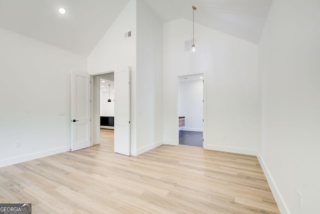 520 SW Rockbridge Rd SW, Lilburn, GA 30047 - unfurnished room featuring high vaulted ceiling and light wood finished floors