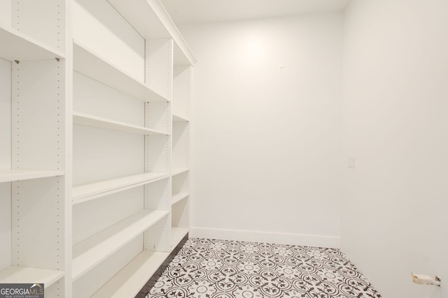520 SW Rockbridge Rd SW, Lilburn, GA 30047 - walk in closet with light tile patterned floors