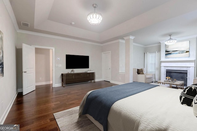 3758 Lake Haven Way, Atlanta, GA 30349 - bedroom with a chandelier, dark wood-style flooring, baseboards, and crown molding