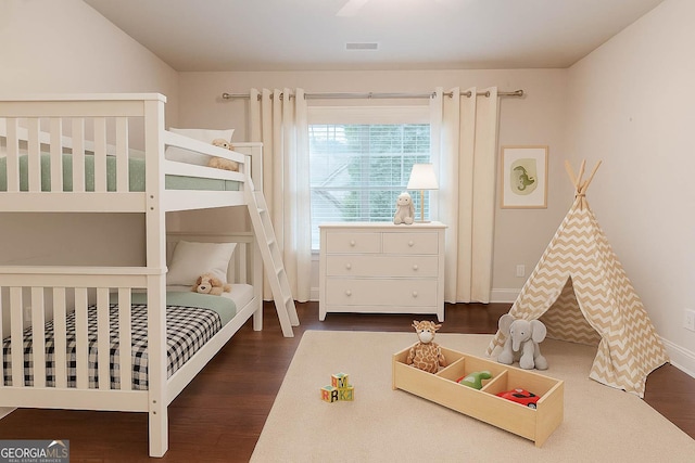 3758 Lake Haven Way, Atlanta, GA 30349 - bedroom with dark wood-style floors and baseboards
