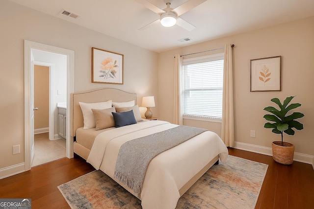 3758 Lake Haven Way, Atlanta, GA 30349 - bedroom featuring dark wood-style flooring, baseboards, and a ceiling fan