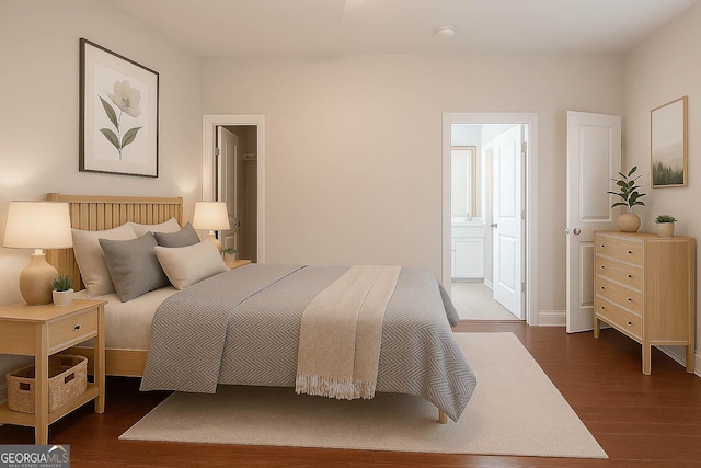 3758 Lake Haven Way, Atlanta, GA 30349 - bedroom with dark wood finished floors, baseboards, and ensuite bathroom