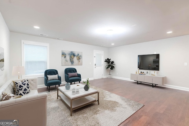 3758 Lake Haven Way, Atlanta, GA 30349 - living area featuring wood finished floors, baseboards, and recessed lighting