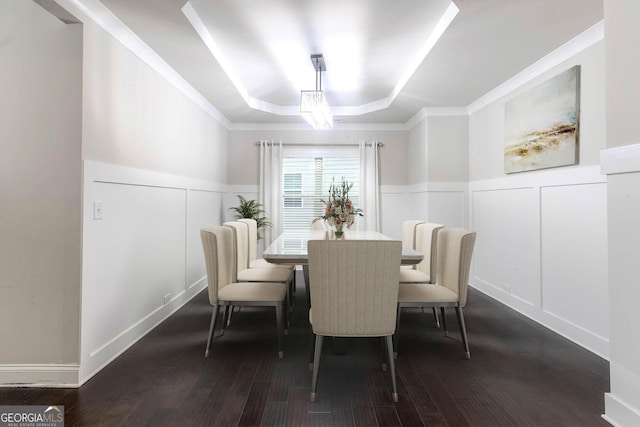 3758 Lake Haven Way, Atlanta, GA 30349 - dining room with a raised ceiling, a decorative wall, wainscoting, and dark wood-style flooring