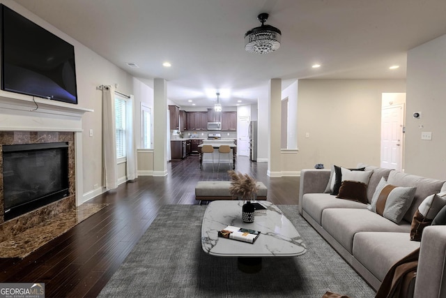 3758 Lake Haven Way, Atlanta, GA 30349 - living area with dark wood-style floors, recessed lighting, baseboards, and a fireplace