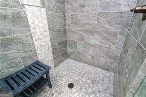 5924 Mitchell St, Flowery Branch, GA 30542 - bathroom with tiled shower