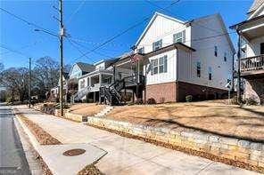 5924 Mitchell St, Flowery Branch, GA 30542 - view of home's exterior featuring a residential view and brick siding