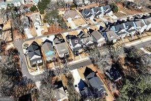 5924 Mitchell St, Flowery Branch, GA 30542 - aerial overview of property's location with nearby suburban area