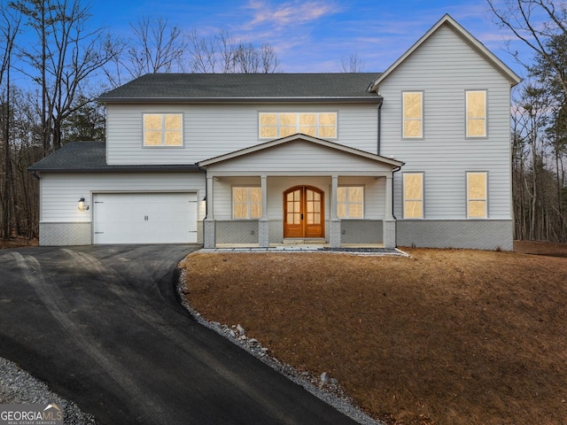 305 Etowah Cove Rd, Dahlonega, GA 30533 - traditional home featuring covered porch, asphalt driveway, an attached garage, and roof with shingles