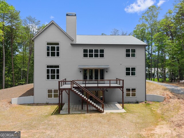305 Etowah Cove Rd, Dahlonega, GA 30533 - back of property with stairway, a deck, a patio, a chimney, and a yard