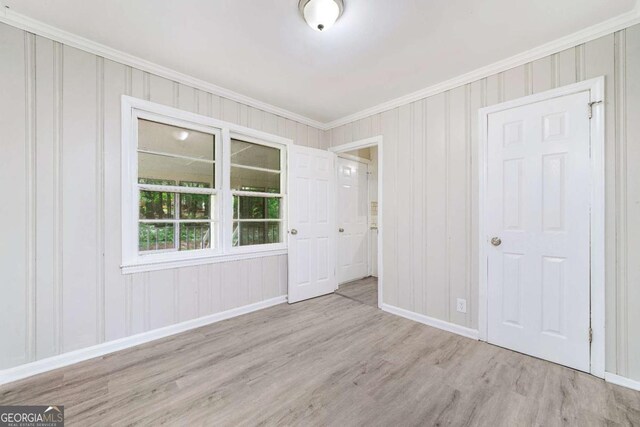 2078 Olive Springs Rd SE, Marietta, GA 30060 - unfurnished bedroom featuring crown molding, wood finished floors, and baseboards