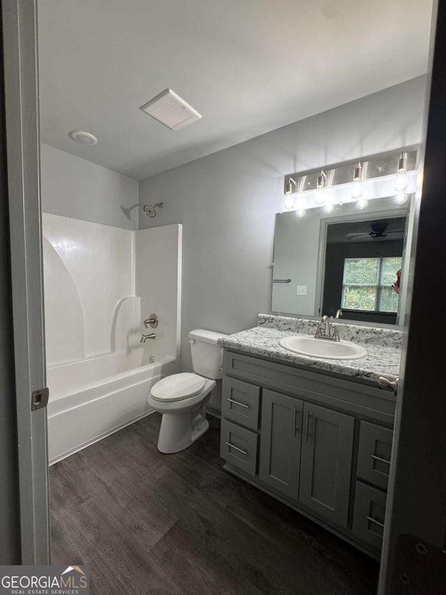 3204 Fairington Village Dr, Lithonia, GA 30038 - full bathroom with vanity, shower / tub combination, and wood finished floors