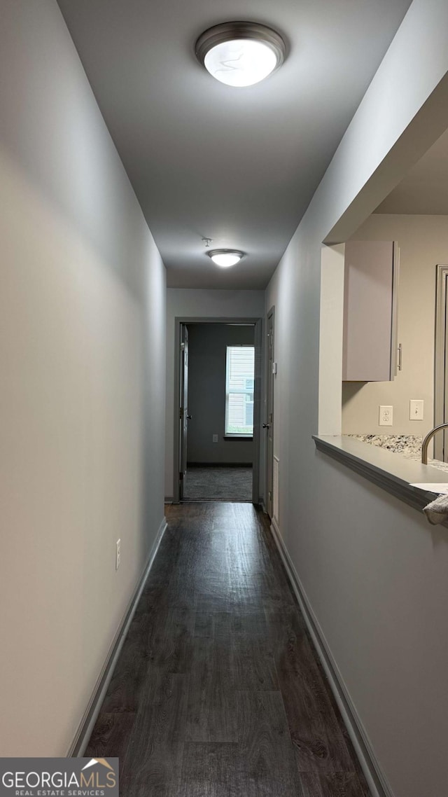 3204 Fairington Village Dr, Lithonia, GA 30038 - hall featuring dark wood finished floors and baseboards