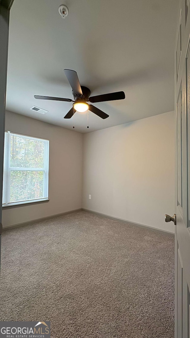 3204 Fairington Village Dr, Lithonia, GA 30038 - carpeted empty room with ceiling fan and fire sprinkler in ceiling