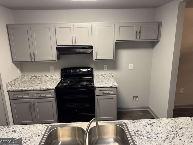 3204 Fairington Village Dr, Lithonia, GA 30038 - kitchen with black electric range oven, exhaust hood, and gray cabinets