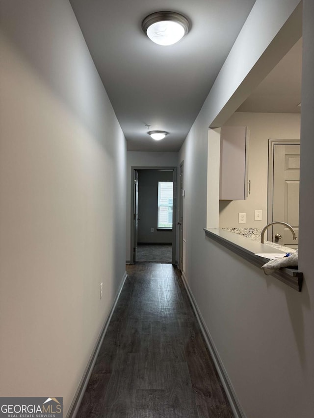 3204 Fairington Village Dr, Lithonia, GA 30038 - hall with dark wood-style flooring and baseboards