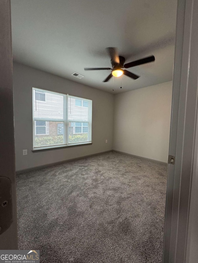 3204 Fairington Village Dr, Lithonia, GA 30038 - carpeted spare room with a ceiling fan