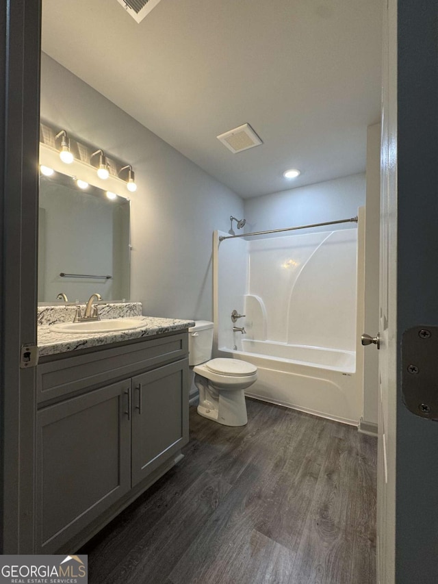 3204 Fairington Village Dr, Lithonia, GA 30038 - bathroom featuring shower / washtub combination, vanity, and wood finished floors