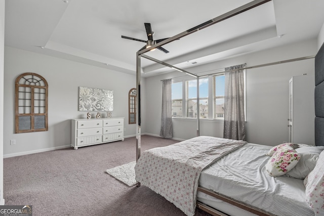 3755 Gardenside Ct, Alpharetta, GA 30004 - carpeted bedroom with a tray ceiling, baseboards, and ceiling fan