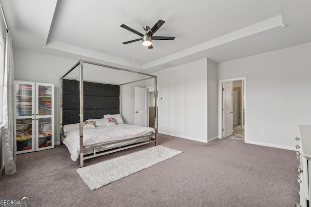 3755 Gardenside Ct, Alpharetta, GA 30004 - carpeted bedroom with a raised ceiling, baseboards, connected bathroom, and ceiling fan