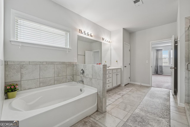 3755 Gardenside Ct, Alpharetta, GA 30004 - bathroom featuring vanity, a bath, and baseboards