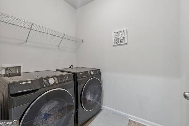 3755 Gardenside Ct, Alpharetta, GA 30004 - washroom with washing machine and dryer and baseboards