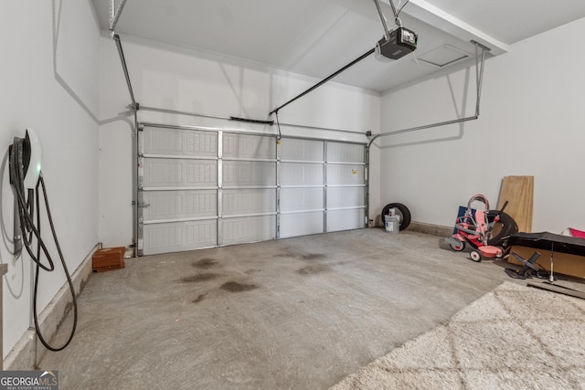 3755 Gardenside Ct, Alpharetta, GA 30004 - garage with a garage door opener and baseboards