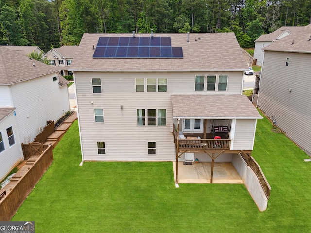 3755 Gardenside Ct, Alpharetta, GA 30004 - rear view of house with a patio area, roof mounted solar panels, a yard, and a shingled roof