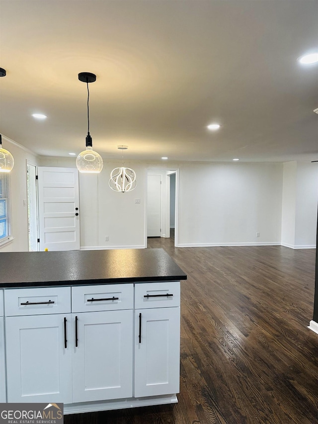 3988 Hartley Bridge Rd, Macon, GA 31216 - kitchen featuring dark countertops, open floor plan, dark wood-style flooring, white cabinets, and recessed lighting