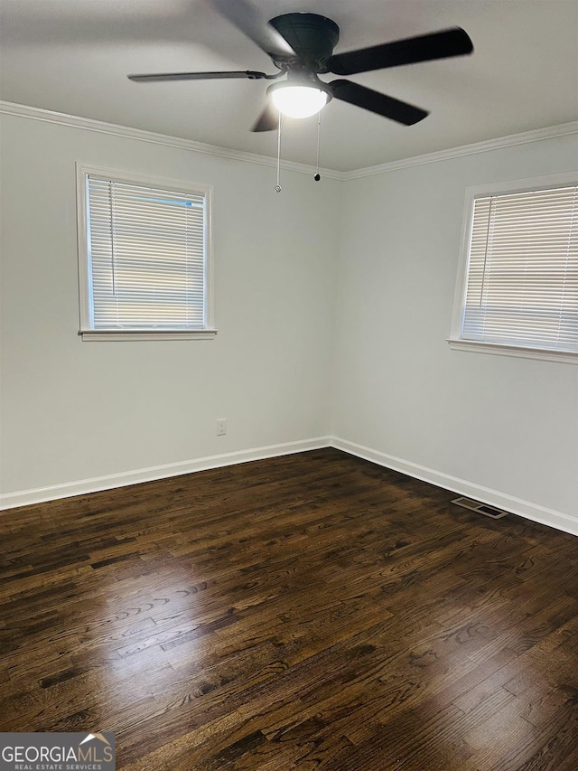 3988 Hartley Bridge Rd, Macon, GA 31216 - spare room with crown molding, dark wood-type flooring, and a ceiling fan