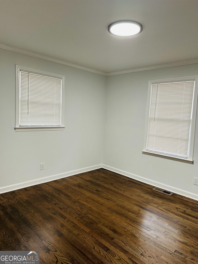 3988 Hartley Bridge Rd, Macon, GA 31216 - spare room with ornamental molding and dark wood-style flooring