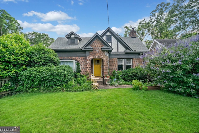 451 S Columbia Dr, Decatur, GA 30030 - english style home featuring brick siding, a front lawn, and a shingled roof