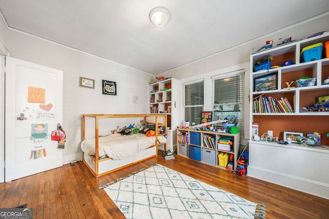 451 S Columbia Dr, Decatur, GA 30030 - bedroom featuring wood-type flooring and crown molding