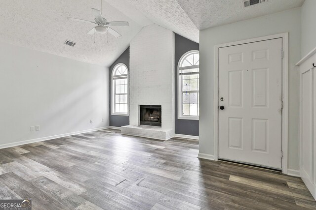 70 Priscilla Way, Newnan, GA 30265 - foyer with ceiling fan, lofted ceiling, a textured ceiling, dark wood-type flooring, and baseboards
