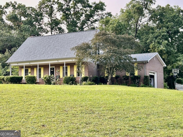 3272 Horace Rd, Bowman, GA 30624 - view of front of property featuring brick siding, a front yard, a garage, a shingled roof, and a porch