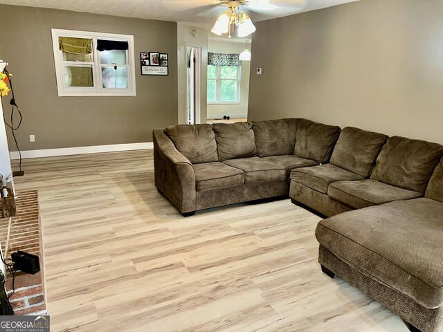 3272 Horace Rd, Bowman, GA 30624 - living room with light wood-style floors, a ceiling fan, and baseboards