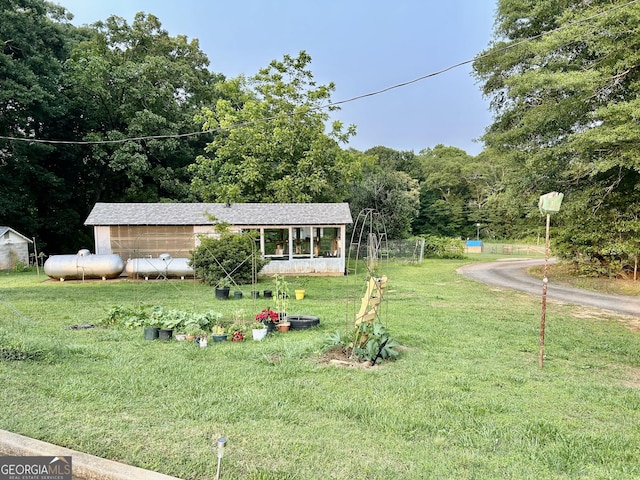 3272 Horace Rd, Bowman, GA 30624 - view of front of home with a front lawn and a view of trees