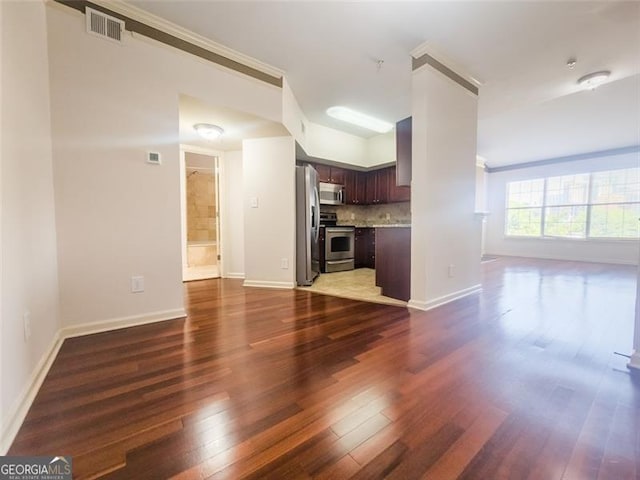 200 Renaissance Pkwy NE Unit 310, Atlanta, GA 30308 - unfurnished living room featuring dark wood-type flooring and crown molding