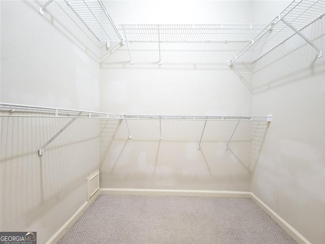 200 Renaissance Pkwy NE Unit 310, Atlanta, GA 30308 - walk in closet with carpet flooring