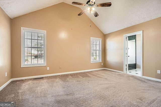 13 Cliff Ct, Villa Rica, GA 30180 - carpeted empty room featuring ceiling fan, a textured ceiling, and high vaulted ceiling