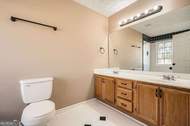 13 Cliff Ct, Villa Rica, GA 30180 - full bath featuring double vanity, tile patterned flooring, a textured ceiling, and a shower