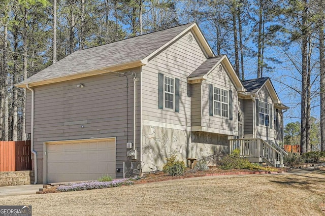 13 Cliff Ct, Villa Rica, GA 30180 - view of side of property with a garage, driveway, and roof with shingles