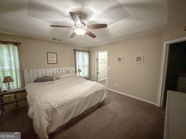 653 Al Roberts Rd, Senoia, GA 30276 - bedroom with dark colored carpet, ceiling fan, and baseboards