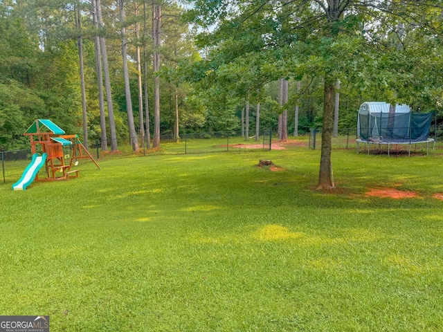 653 Al Roberts Rd, Senoia, GA 30276 - view of yard featuring a trampoline and a playground